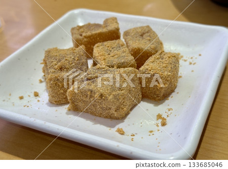 Close-up of warabi mochi sprinkled with soybean flour Close-up of warabi mochi sprinkled with soybean flour 133685046