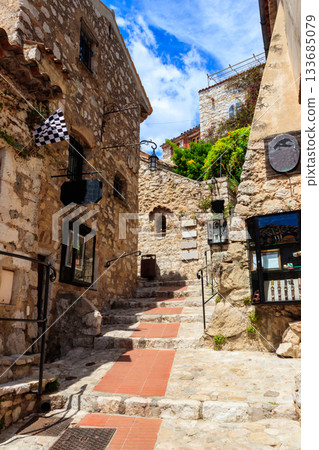 Narrow street in medieval Eze village in French Riviera, France 133685079