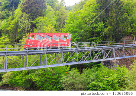 Red funicular to Niesen mountain in Switzerland 133685096