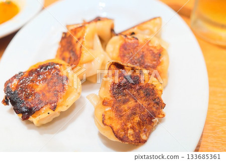 Fragrantly cooked hot gyoza dumplings Fragrantly cooked hot gyoza dumplings 133685361