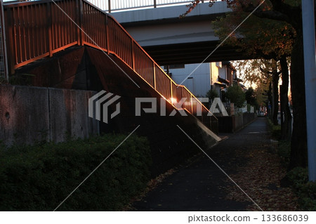 I took a photo of the stairs glowing red in the sunset. 133686039
