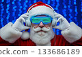 Santa Claus wearing futuristic glasses and headphones, listening to music 133686189