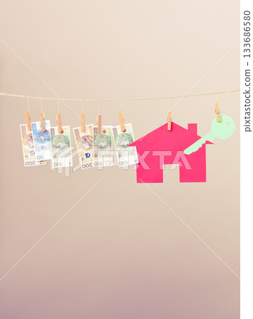 House with key and banknotes 133686580