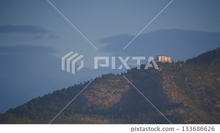 Spanish coast landscape with church on hill 133686626