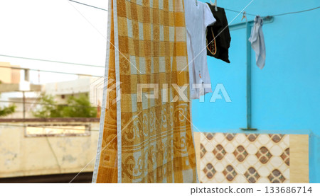 Towel and Clothes Drying on Outdoor Clothesline 133686714