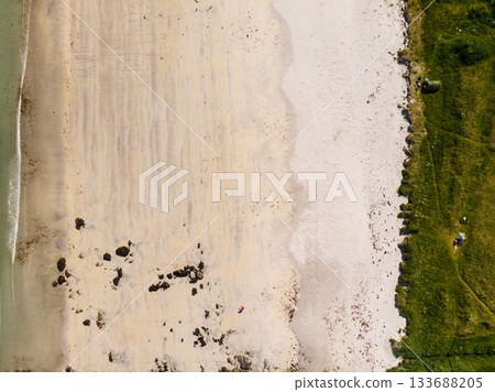 Aerial view. Sea water and sandy shoreline Aerial view. Sea water and sandy shoreline 133688205