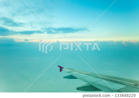 View from plane window, cloud sky View from plane window, cloud sky 133688220