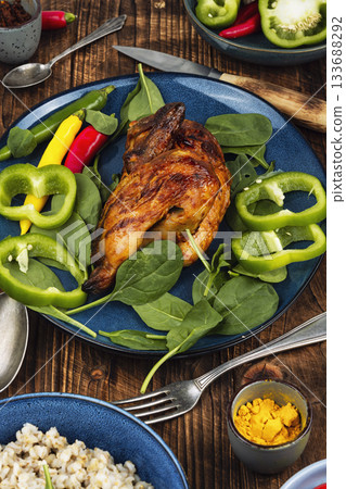 Grilled chicken and porridge, rustic style.. Grilled chicken and porridge, rustic style.. 133688292