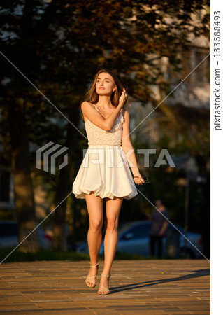 Slavic Woman Walking in Warm Golden Light 133688493
