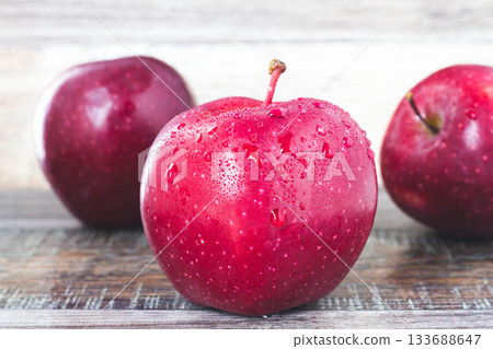 Fresh apple.Juicy ripe apple close-up on a white background. Fresh apple.Juicy ripe apple close-up on a white background. 133688647