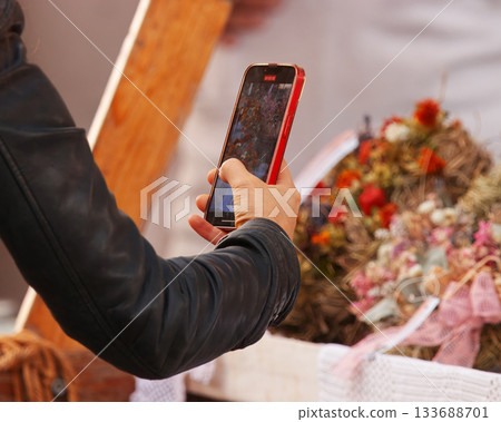 Taking photo of flower stall at Naplavka farmers market Prague Taking photo of flower stall at Naplavka farmers market Prague 133688701