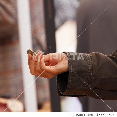 Paying cash with Euro coins at Naplavka farmers market 133688742
