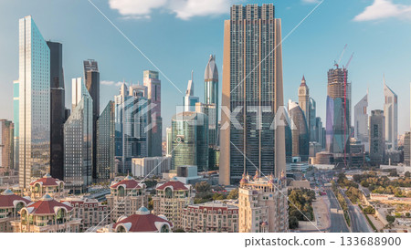 Aerial view on downtown and financial district in Dubai timelapse, United Arab Emirates with skyscrapers and highways. 133688900