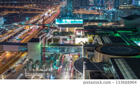 Aerial view of shopping mall with Financial center road night timelapse Aerial view of shopping mall with Financial center road night timelapse 133688904