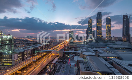 Aerial view of Financial center road night to day timelapse with under construction building 133688908