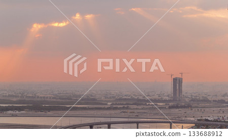 Construction and intersection near Dubai Creek Harbor aerial timelapse during sunrise. Dubai - UAE. 133688912