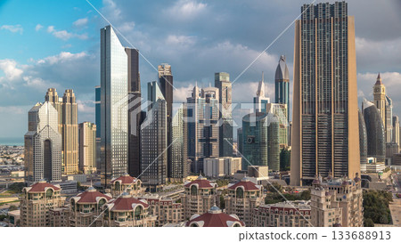 Aerial view on downtown and financial district in Dubai timelapse, United Arab Emirates with skyscrapers and highways. 133688913