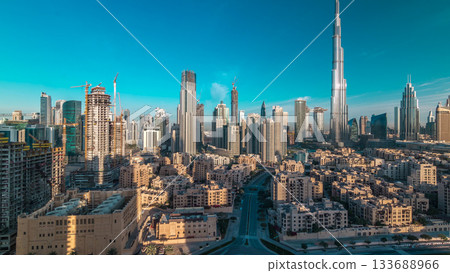 Dubai Downtown skyline timelapse with Burj Khalifa and other towers during sunrise panoramic view from the top in Dubai Dubai Downtown skyline timelapse with Burj Khalifa and other towers during sunrise panoramic view from the top in Dubai 133688966