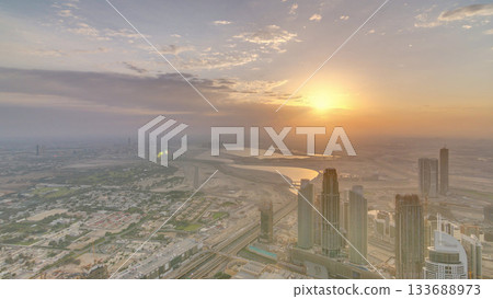 Downtown of Dubai in the morning timelapse during sunrise. Aerial view with towers and skyscrapers 133688973