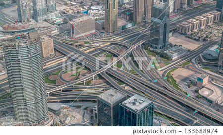 Aerial morning view of highway interchange in Dubai downtown timelapse. 133688974