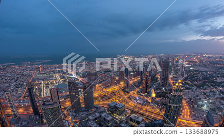 Downtown of Dubai night to day timelapse before sunrise. Aerial view with towers and skyscrapers 133688975