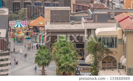 Aerial view of beach and tourists walking and sunbathing on holiday in JBR timelapse in Dubai, UAE Aerial view of beach and tourists walking and sunbathing on holiday in JBR timelapse in Dubai, UAE 133688989