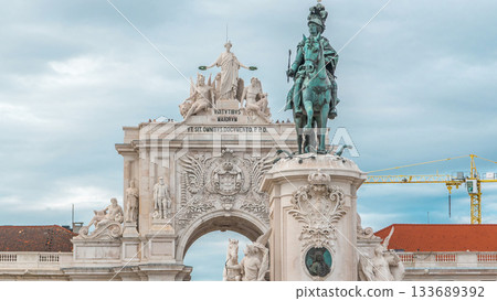 Triumphal arch at Rua Augusta and bronze statue of King Jose I at Commerce square timelapse in Lisbon, Portugal. Triumphal arch at Rua Augusta and bronze statue of King Jose I at Commerce square timelapse in Lisbon, Portugal. 133689392