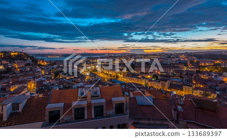 Lisbon after sunset aerial panorama view of city centre with red roofs at Autumn day to night timelapse, Portugal 133689397