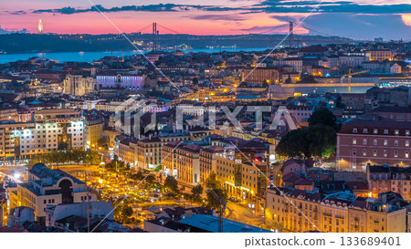 Lisbon after sunset aerial panorama view of city centre with red roofs at Autumn day to night timelapse, Portugal 133689401
