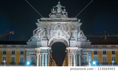 Triumphal arch at Rua Augusta at Commerce square night timelapse in Lisbon, Portugal. 133689403
