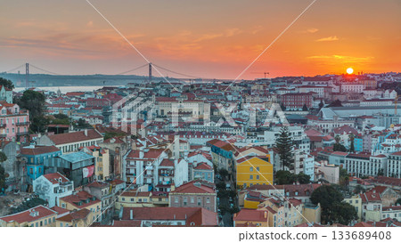 Lisbon at sunset aerial panoramic view of city centre with red roofs at autumn evening timelapse, Portugal Lisbon at sunset aerial panoramic view of city centre with red roofs at autumn evening timelapse, Portugal 133689408
