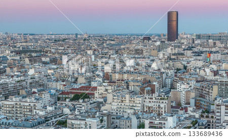 Aerial panorama above houses rooftops in a Paris day to night timelapse 133689436