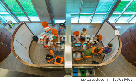 Young creative people in modern office timelapse. Group of young business people and students are working together Young creative people in modern office timelapse. Group of young business people and students are working together 133689465