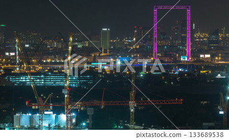 Dubai skyline night timelapse with illuminated landmarks 133689538