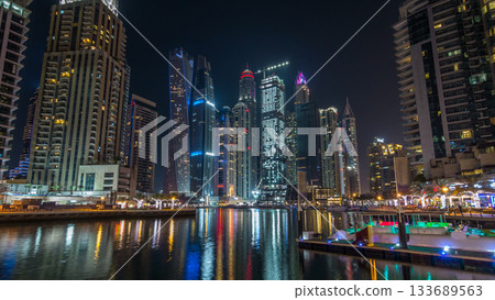 Dubai marina bay with yachts an boats night timelapse hyperlapse Dubai marina bay with yachts an boats night timelapse hyperlapse 133689563