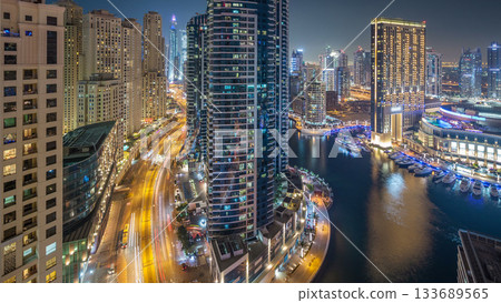 Night illumination of Dubai Marina aerial timelapse, UAE. Night illumination of Dubai Marina aerial timelapse, UAE. 133689565
