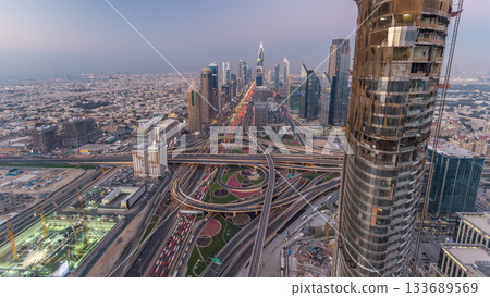 Scenic Dubai downtown skyline day to night timelapse. Rooftop view of Sheikh Zayed road Scenic Dubai downtown skyline day to night timelapse. Rooftop view of Sheikh Zayed road 133689569