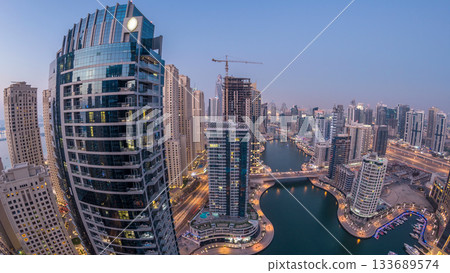 Beautiful aerial top view day to night transition timelapse of Dubai Marina canal Beautiful aerial top view day to night transition timelapse of Dubai Marina canal 133689574