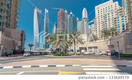 Panoramic view with modern skyscrapers and yachts of Dubai Marina timelapse hyperlapse, United Arab Emirates 133689579