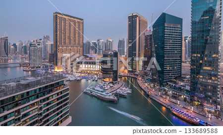 Beautiful aerial top view day to night transition timelapse of Dubai Marina canal 133689588