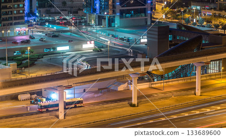 Aerial view of Jumeirah lakes towers skyscrapers night timelapse with traffic on sheikh zayed road. Aerial view of Jumeirah lakes towers skyscrapers night timelapse with traffic on sheikh zayed road. 133689600