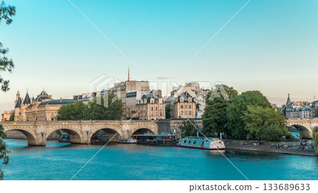 Sunset timelapse over Seine river, Pont Neuf bridge and Cite island with Royal palace. Paris, France Sunset timelapse over Seine river, Pont Neuf bridge and Cite island with Royal palace. Paris, France 133689633