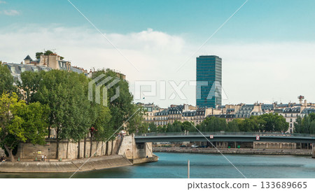 Waterfront of the river Seine near Notre Dame with Saint-Louis bridge timelapse. Waterfront of the river Seine near Notre Dame with Saint-Louis bridge timelapse. 133689665