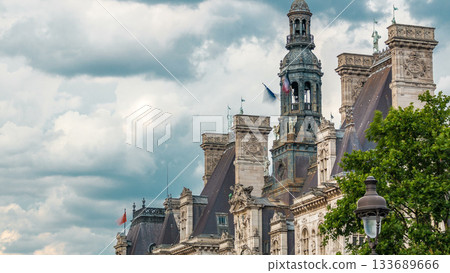 Architecture of The Hotel de Ville City Hall with french flag on tower timelapse, the building housing the local administration of the city of Paris 133689666