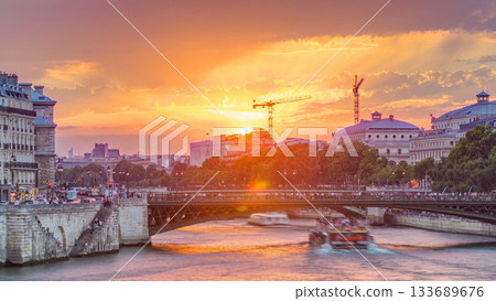 Le Pont D'Arcole bridge at sunset with boats timelapse, Paris, France, Europe 133689676