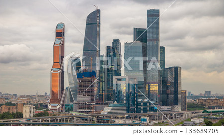 Business complex of skyscrapers Moscow city timelapse. In the foreground the railway and automobile overpass. Business complex of skyscrapers Moscow city timelapse. In the foreground the railway and automobile overpass. 133689705