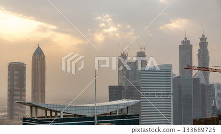 Dubai business bay towers at sunset aerial timelapse. 133689725