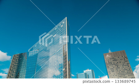 Unique skyscraper timelapse in famous financial and business district of Paris - La Defense. Unique skyscraper timelapse in famous financial and business district of Paris - La Defense. 133689745