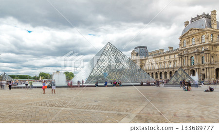 The large glass pyramid and the main courtyard of the Louvre Museum timelapse hyperlapse. Paris, France The large glass pyramid and the main courtyard of the Louvre Museum timelapse hyperlapse. Paris, France 133689777