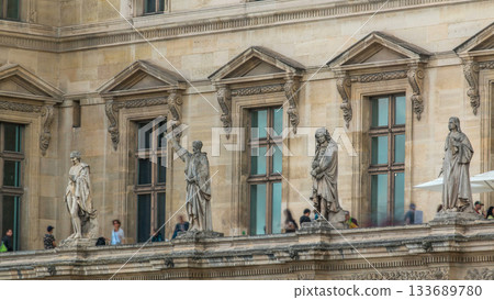 The facade of a building with male statues in the vicinity of the historic building timelapse, Paris, France. The facade of a building with male statues in the vicinity of the historic building timelapse, Paris, France. 133689780